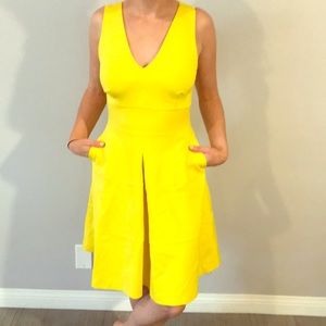Yellow cross back fit and flare dress
